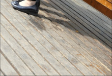 Grandmother and girl dangling right foot